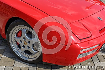 Fore part of the red sports car Porsche 944 at the cityâ€™s Retro Car Show Editorial Stock Photo